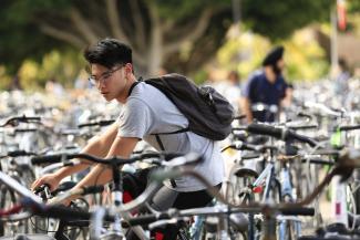 student at bike rack